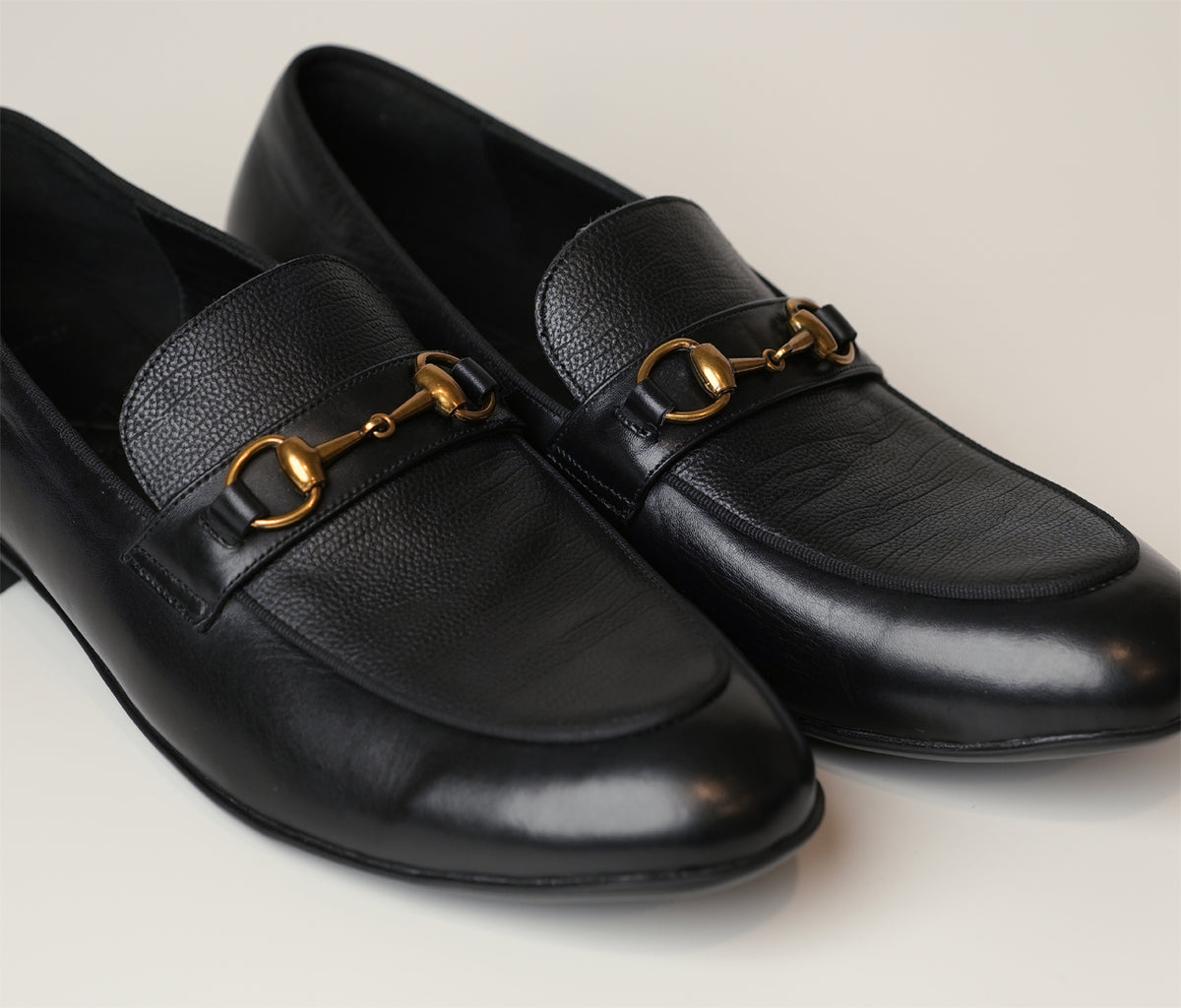 Introducing Colin, a black loafer crafted from full-grain Italian leather, featuring a gold horsebit buckle. Now at The Butler Sri Lanka.