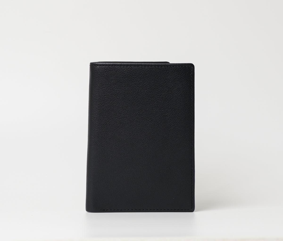 Full-Grain Leather Passport Cover with pebble-grain leather, 3 card slots, 1 cash pocket, and document storage. Sleek and functional