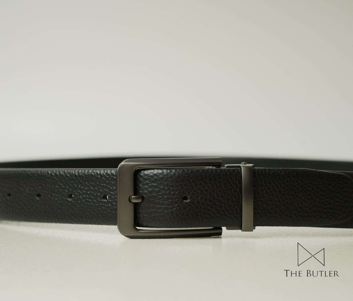 Bannister Black pebble-grain leather belt with a rectangular matte chrome zinc alloy buckle, ideal for formal and office wear.