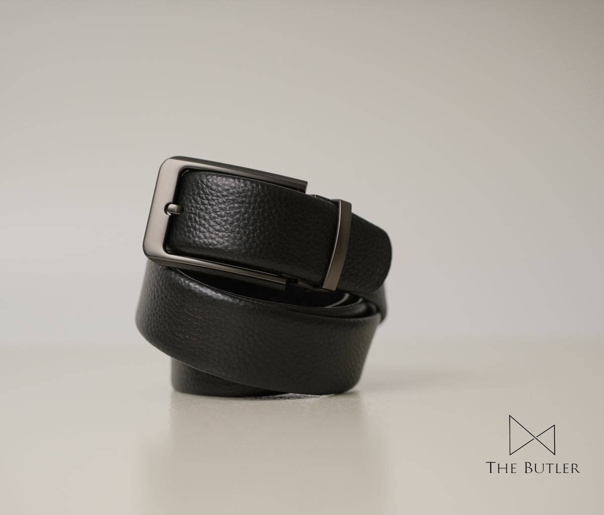 Bannister Black pebble-grain leather belt with a rectangular matte chrome zinc alloy buckle, ideal for formal and office wear.