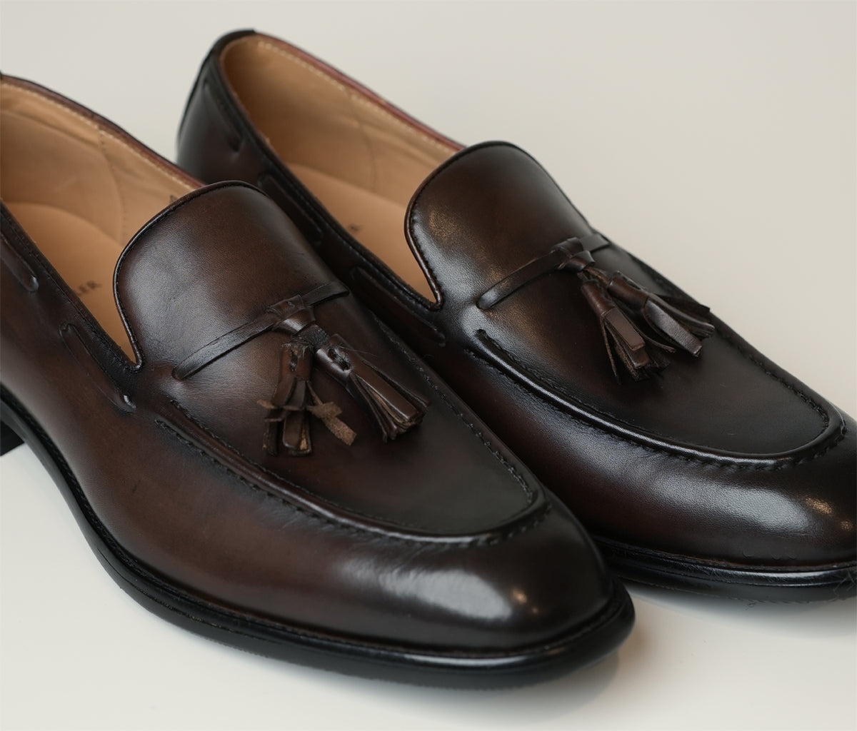 Milano Brown Tassel Loafer is a hand-tanned full-grain leather loafer in tan brown with elegant accents and stitching, available at The Butler Sri Lanka